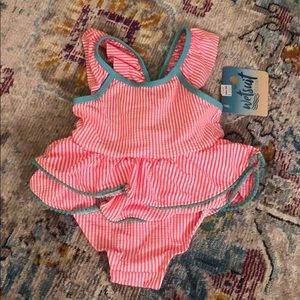 Pink and white striped one piece with teal detail